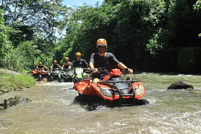 Bali ATV Quad Bike Adventure and Snorkeling Tour - Riding the 250cc ATV near Ubud
