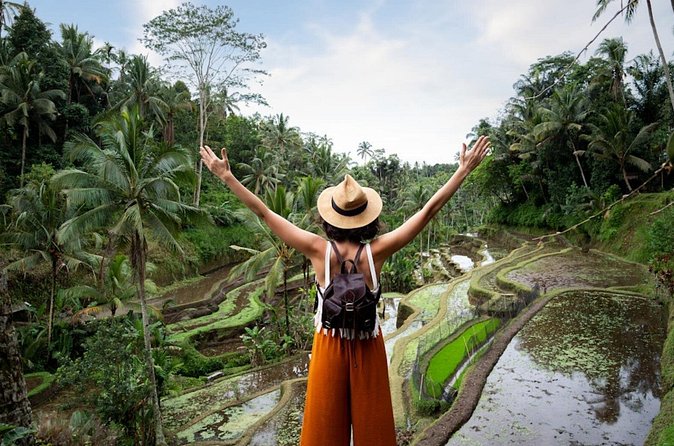 Private Ubud Day Tour Waterfalls Sacred Monkeys and Rice Fields - Crossing the terraces at Tegalalang
